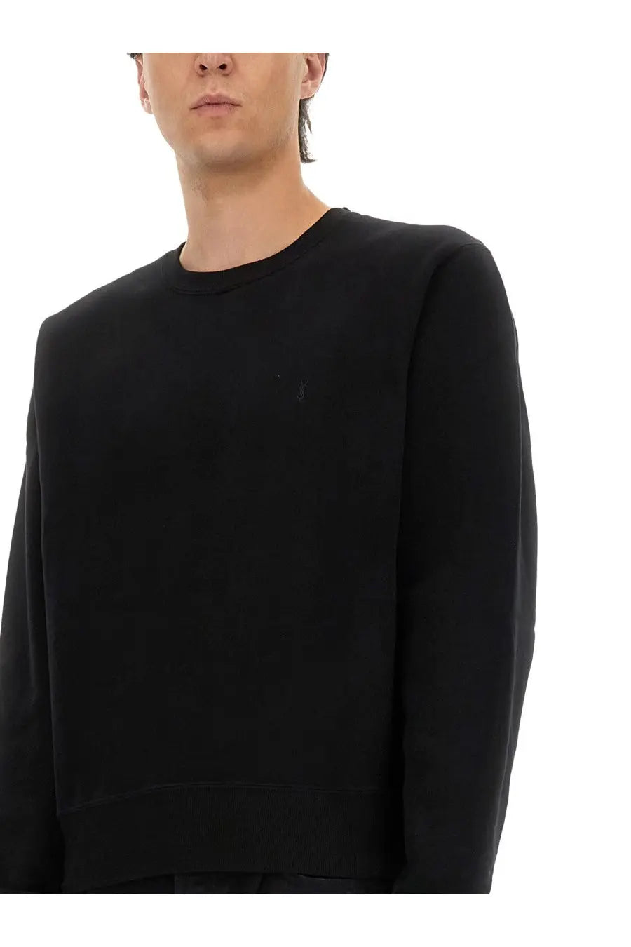 Saint Laurent men’s Cassandras black crewneck sweatshirt with subtle embroidered logo on left chest in cotton material