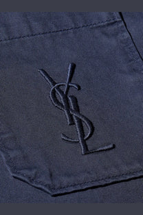 Dark blue embroidered ysl logo on textured cotton pocket of saint laurent men’s cassandre certified cotton overshirt