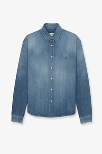 Saint Laurent men’s Cassandre Horizon blue denim button-up shirt with subtle faded wash and embroidered logo on left chest