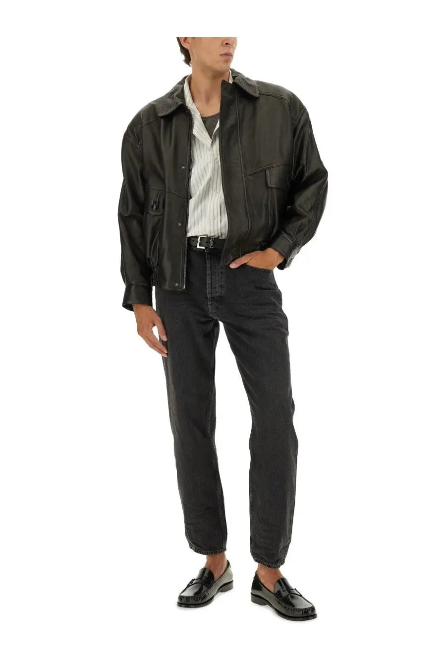 Black leather jacket with flap pockets and a collar styled over saint laurent men’s cassandre striped white shirt