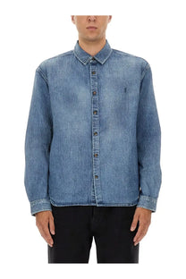 Saint Laurent men’s blue denim button-up shirt with subtle faded wash and small embroidered logo on left chest