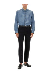 Saint Laurent men’s blue denim button-up shirt with subtle textured pattern and small embroidered logo on left chest