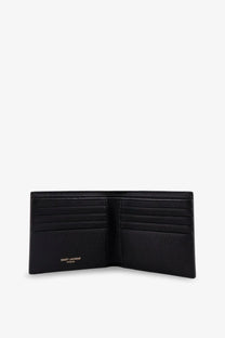 Saint Laurent men’s east west tiny black leather wallet with six card slots and embossed gold logo on the front