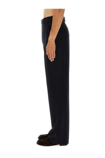 Saint Laurent men’s high waist black tailored trousers with sleek straight-leg cut and subtle waistband pleats