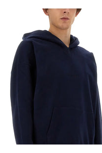 Navy blue oversized Saint Laurent men’s hoodie with subtle embroidered logo on chest in soft cotton material