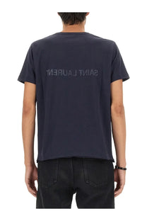 Dark navy blue saint laurent men’s inverted shirt showing back with subtle tonal logo print across the back