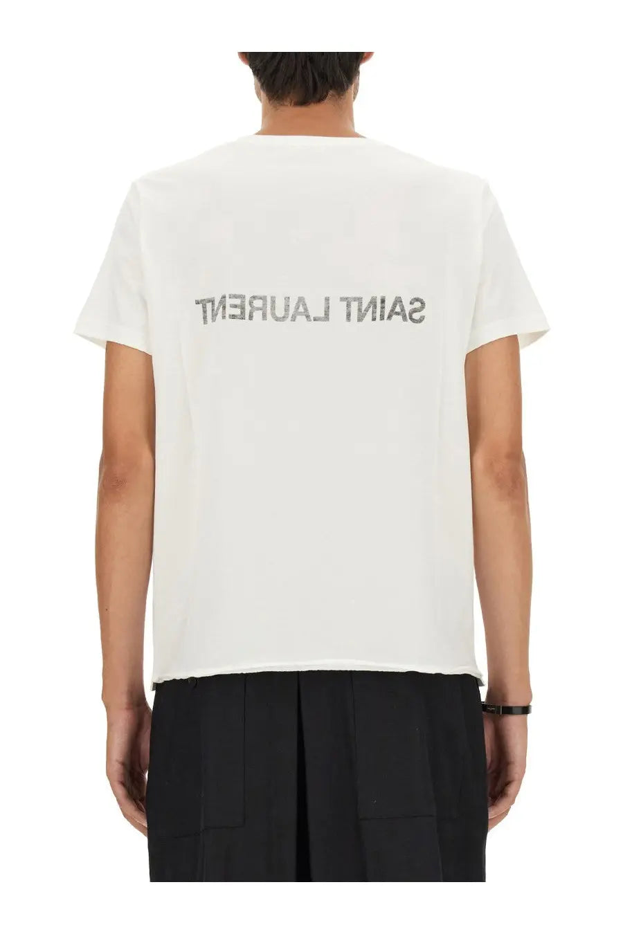 Back of white saint laurent men’s inverted t-shirt with silver glitter logo across the back
