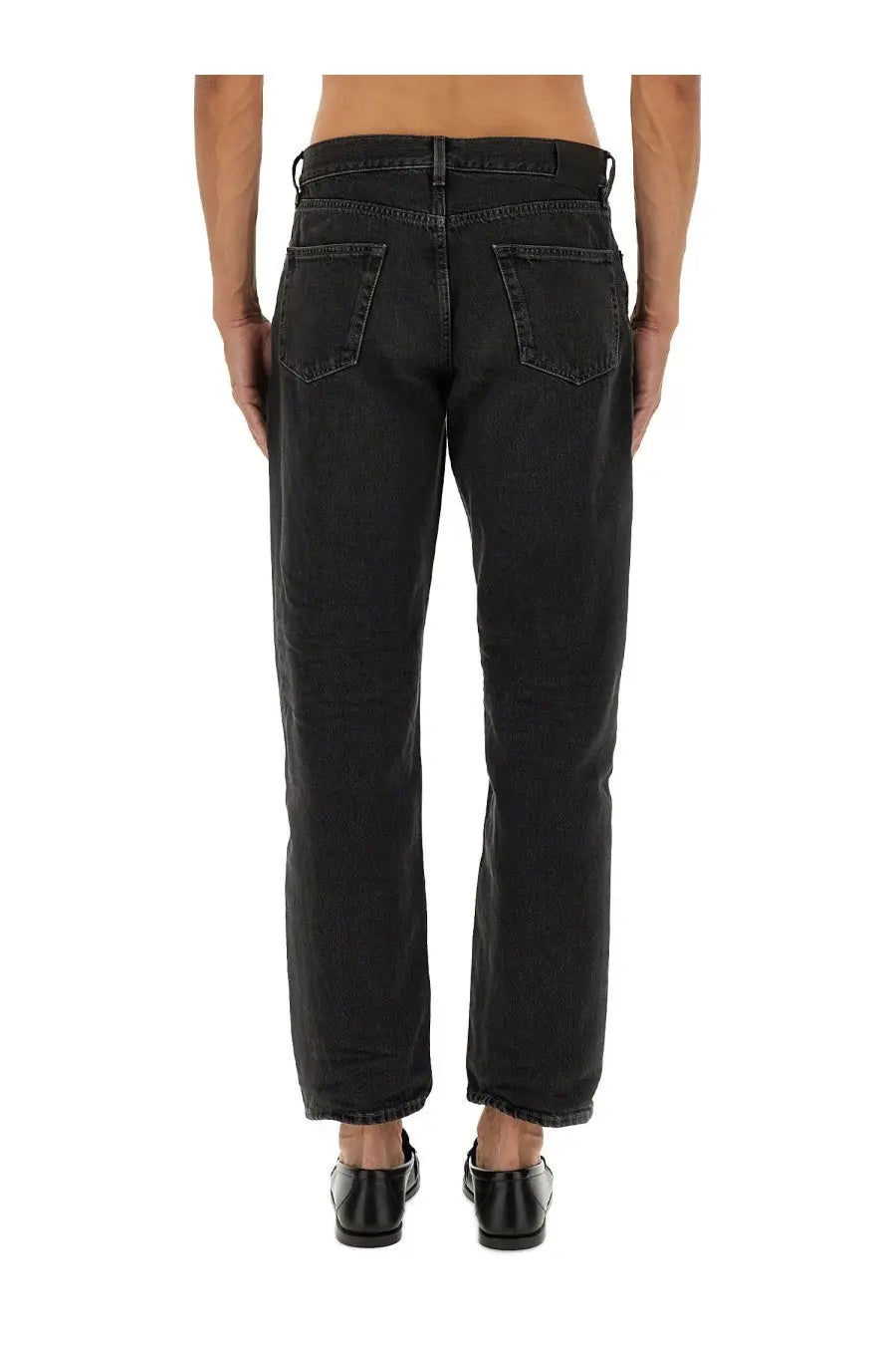 Black denim saint laurent men’s jeans mick with straight-leg cut and classic back pockets shown from the back side
