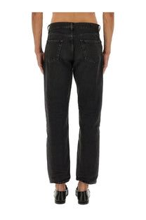 Black denim saint laurent men’s jeans mick with straight-leg cut and classic back pockets shown from the back side