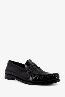 Saint Laurent men’s le loafer black patent leather loafer with a glossy finish and frayed detailing on the toe