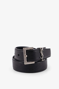Saint Laurent men’s black leather belt with silver-toned rectangular buckle featuring the YSL logo