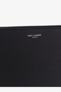 Black textured leather Saint Laurent men’s clutch with silver embossed saint laurent paris lettering on front