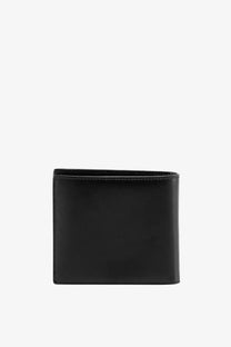 Saint Laurent men’s black leather wallet with clean minimalist design and precise stitching along the edges