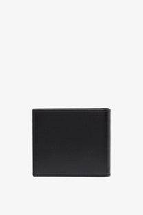 Saint Laurent men’s black leather wallet with subtle textured surface and precise stitching along the edges