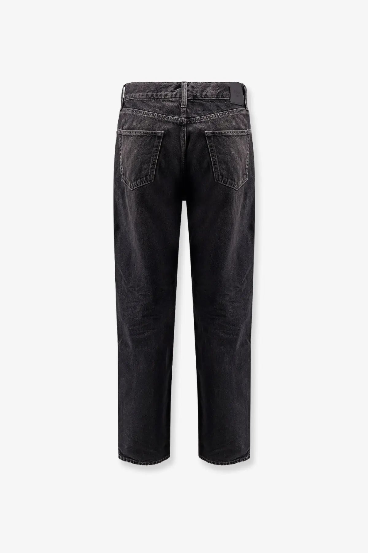 Saint Laurent men’s long Mick black denim trousers in black showing faded distressed back with classic pockets