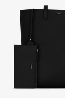 Saint Laurent men’s north south black leather tote bag with matching zippered pouch for daily use