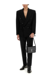 Black leather crossbody bag with silver ysl logo paired with saint laurent men’s oversize black jacket