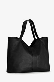 Saint Laurent men’s oversize black leather tote bag with dual handles and minimalist design