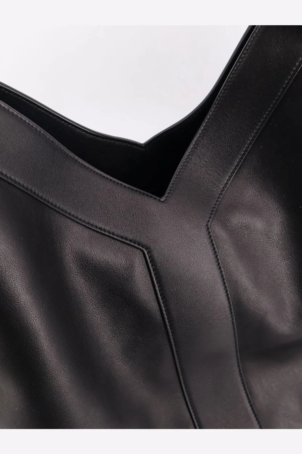 Saint Laurent men’s oversize black leather shoulder bag with minimalist stitching and structured design