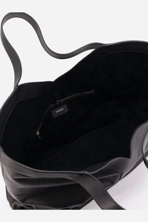 Saint Laurent men’s oversize black leather tote bag with soft wrinkled texture and minimalist design