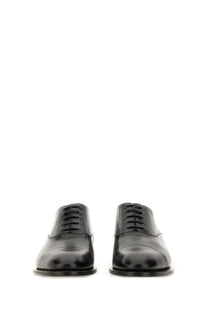 Saint Laurent men’s Oxford shoe Adrien black in black patent leather with glossy finish and classic lace-up design