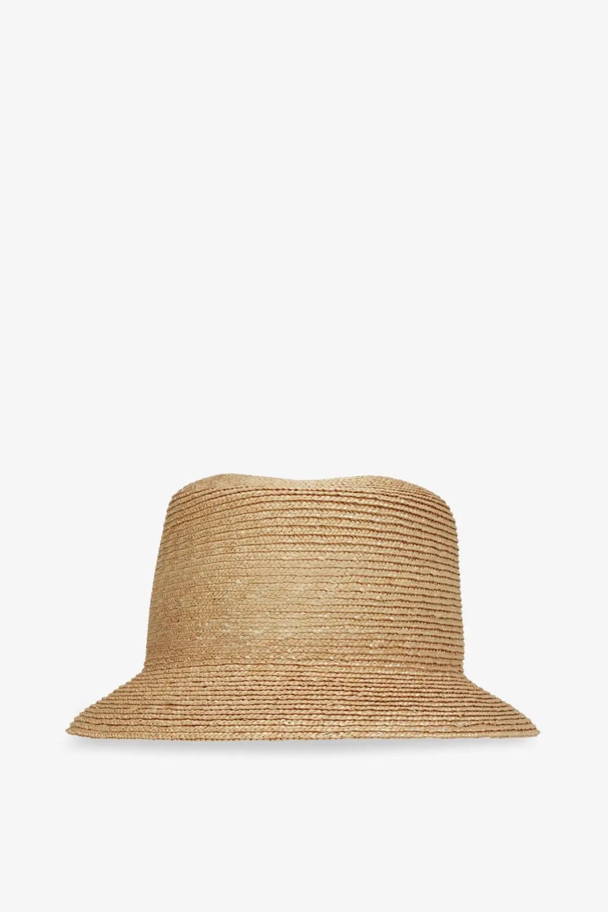 Beige woven straw bucket hat with wide brim and subtle horizontal ribbing from Saint Laurent men’s raffia fedora collection