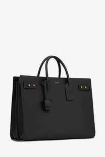 Saint Laurent men’s sac de jour large black leather sac de voyage tote bag with gold-tone hardware and top handles