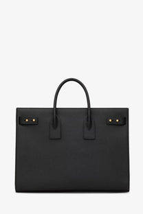 Black textured leather Saint Laurent men’s sac de jour large tote bag with gold-tone hardware and top handles