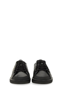 Saint Laurent men’s smooth black leather low-top gym sneaker with sleek minimalist design and subtle gold logo on side