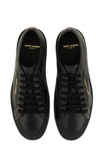 Saint Laurent men’s smooth leather gym sneaker in black with gold branding on sides and lining