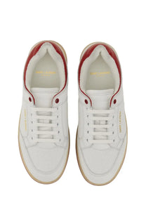 White saint laurent men’s sneakers with red accents and gold branding in leather for stylish casual wear