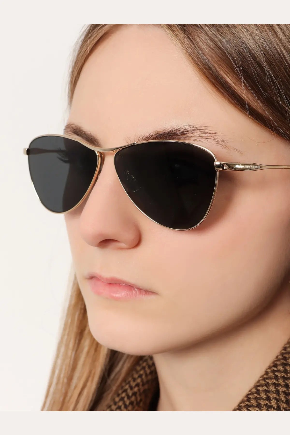 Saint Laurent women’s acetate aviator sunglasses in gold tone with dark gray lenses and black accents