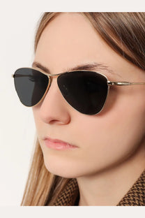 Saint Laurent women’s acetate aviator sunglasses in gold tone with dark gray lenses and black accents