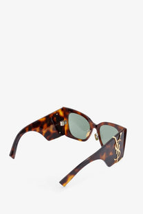 Saint Laurent women’s tortoiseshell acetate sunglasses with green lenses and gold tone ysl logo detailing