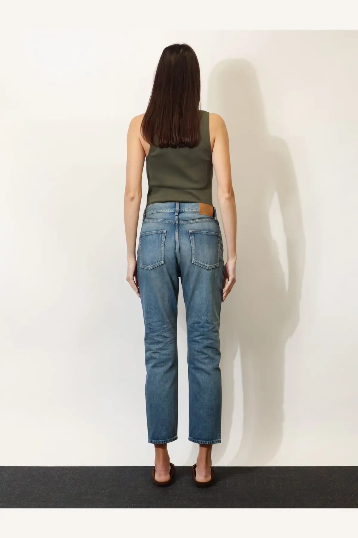 Saint laurent women’s ankle midi blue denim jeans with medium-wash straight-leg cut and brown leather patch