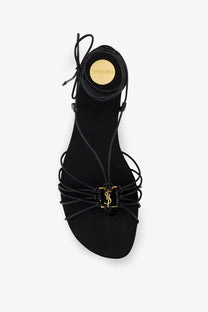 Saint Laurent women’s babylone black leather sandals with gold-tone ysl logo clasp and circular brand plaque