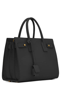 Saint Laurent women’s bag sac de jour baby black in black leather with gold-tone hardware and structured design
