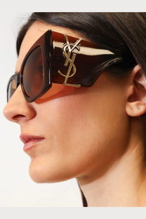 Saint Laurent women’s brown tortoiseshell acetate sunglasses with gold-tone logo on the temple