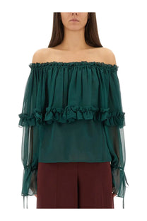 Saint Laurent women’s emerald green silk off the shoulder blouse with layered ruffles and sheer long sleeves