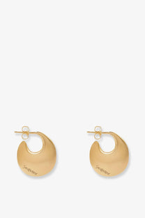 Saint Laurent women’s gold brass hoop earrings with smooth polished finish and saint laurent engraving