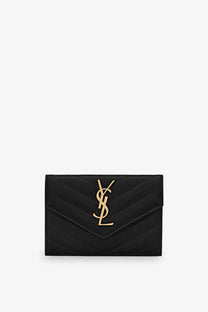 Black quilted leather ysl card case with gold-tone interlocking monogram logo from saint laurent women’s cassandre wallet