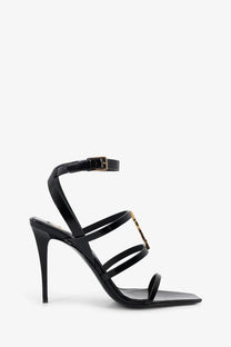 Saint Laurent women’s cassandre black patent leather strappy high-heeled sandals with gold-tone hardware accents