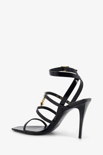 Saint Laurent women’s Cassandre patent leather sandals in black with strappy design and gold-tone hardware