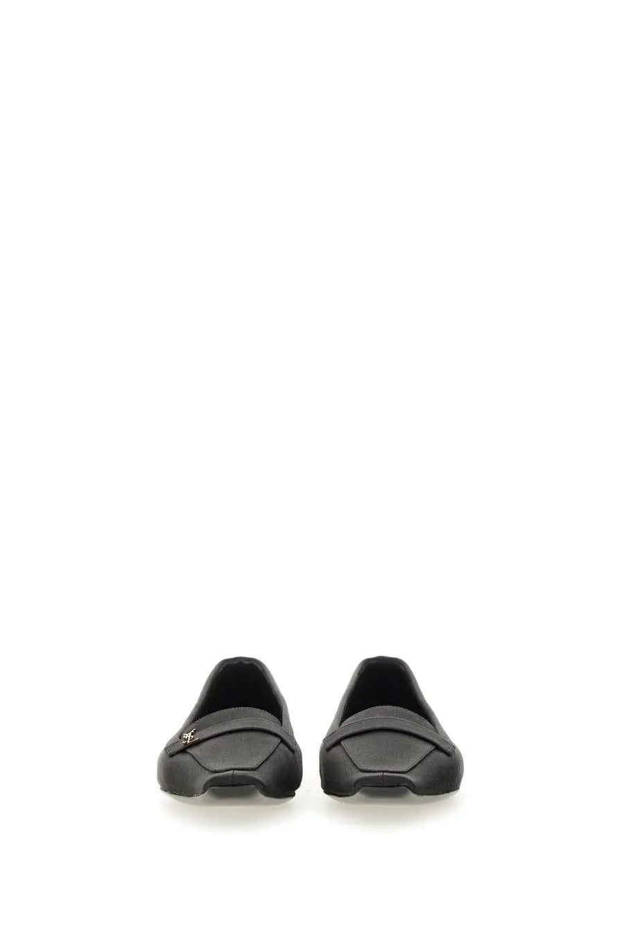 Saint Laurent women’s black leather loafers with subtle metallic logo on the vamp for elegant wear