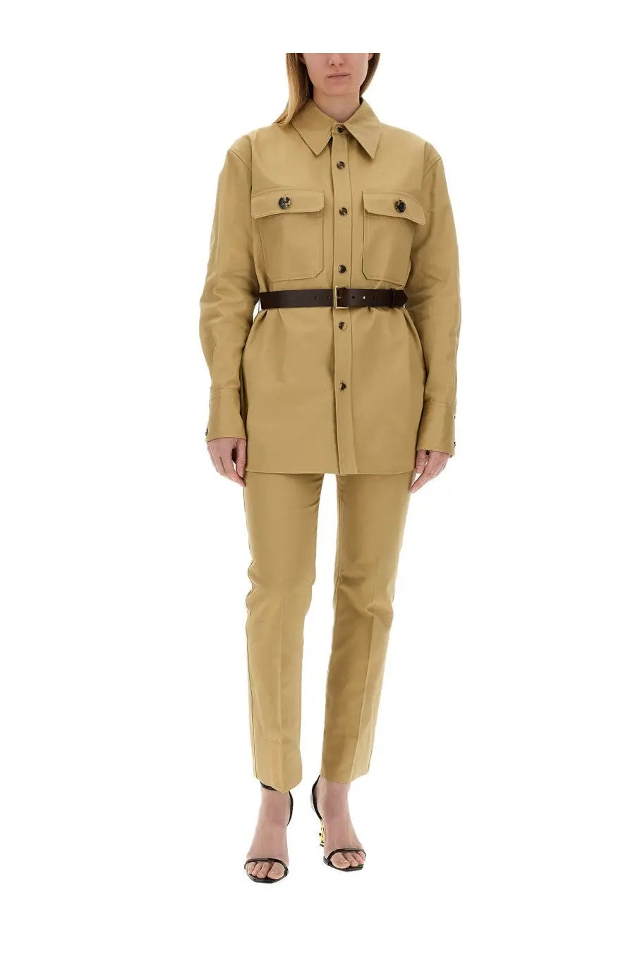 Tan Saint Laurent women’s drill pants beige set with utility-style button-up shirt and dark brown belt accents