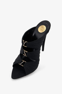 Saint Laurent women’s Emilie black satin mule heels with gold-tone lv monogram buckles and high stiletto soles