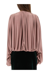 Saint Laurent women’s fluid knit blouse in soft dusty rose with flowing pleated sleeves and gathered waistline