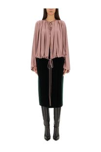 Saint Laurent women’s fluid knit blouse in dusty rose with long sleeves gathered neckline and matching drawstring ties