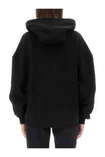 Saint Laurent women’s black oversized hoodie with relaxed boxy fit and ribbed cuffs