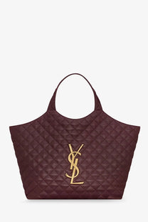 Saint Laurent women’s Icare quilted leather tote bag in burgundy with gold-tone YSL logo emblem
